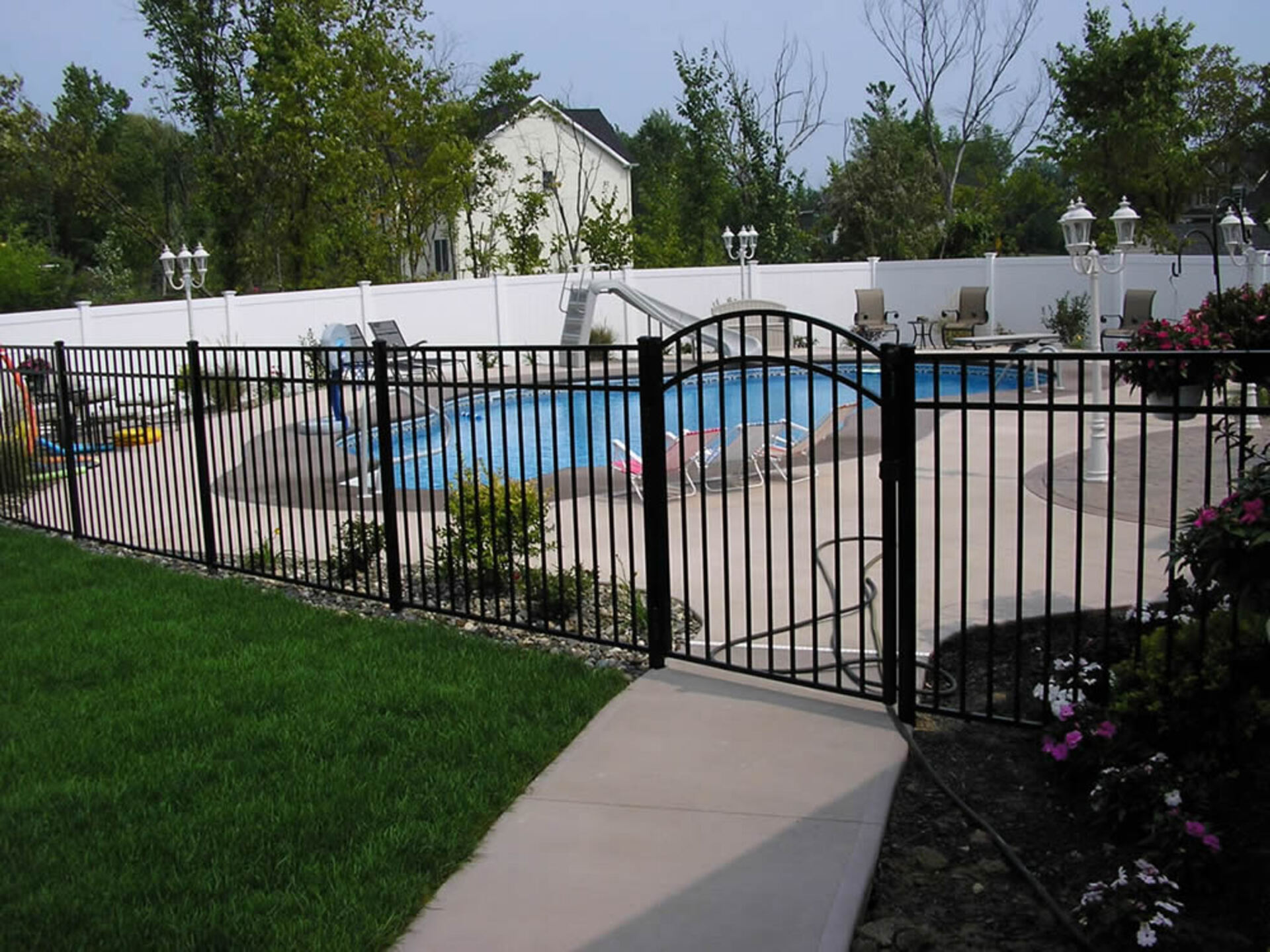 Pool with fencing and arched gate